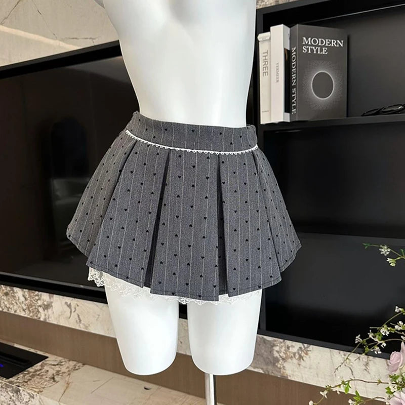 JUPE PLISSEE A NOEUD EN DENTELLE